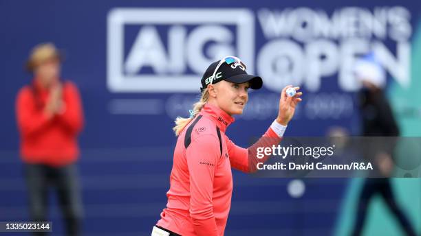 Madelene Sagstrom of Sweden acknowledges the crowd following a bogey on the eighteenth hole during Day One of the AIG Women's Open at Carnoustie Golf...