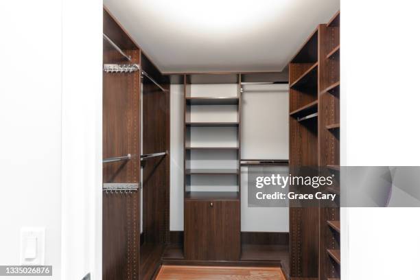 empty walk-in-closet - armadio a muro foto e immagini stock