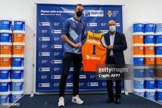 Victor Claver and Paco Raga, Honorary President of Valencia Basket, poses for photo during his presentation as new player of Valencia Basket on...