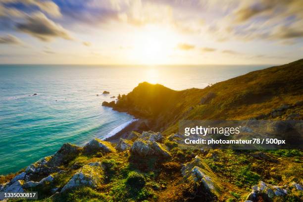 scenic view of sea against sky during sunset,la hague,france - the hague stock-fotos und bilder