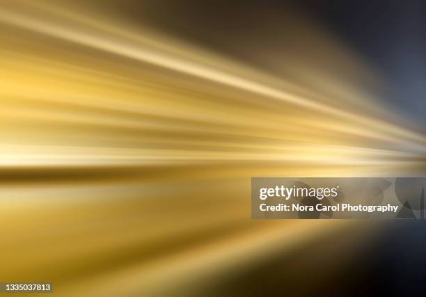 motion blur gold colored background - gold abstract stock pictures, royalty-free photos & images