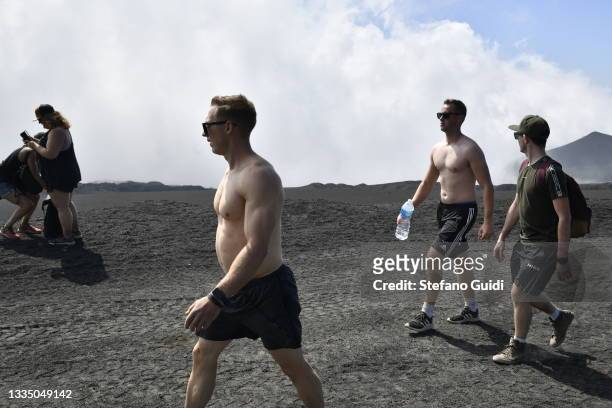 Tourists visiting the Etna Volcano on August 19, 2021 in Etna, near Catania, Italy. Etna is a volcano from Sicily originating in quaternary, and is...