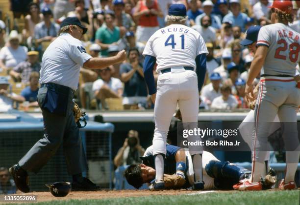 Los Angeles Dodgers Mike Scioscia lays unconscious after violent collision at home plate with Cardinals Jack Clark during playoff series of the Los...