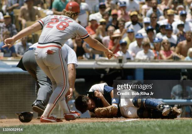 Los Angeles Dodgers Mike Scioscia lays unconscious after violent collision at home plate with Cardinals Jack Clark during playoff series of the Los...