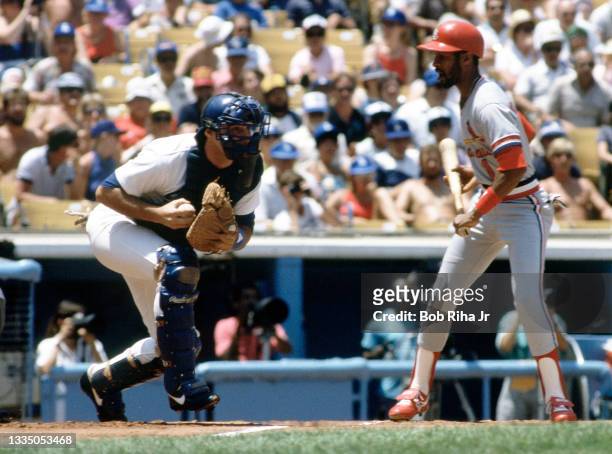 St. Louis Cardinals Ozzie Smith watches Los Angeles Dodgers catcher Mike Scioscia keeps baserunner at bay during playoff series of the Los Angeles...