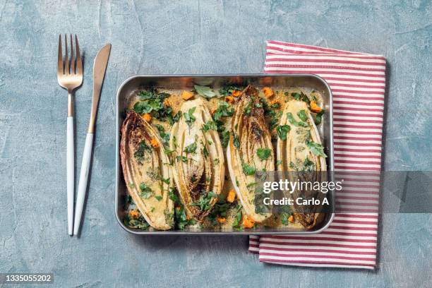 baked endive with breadcrumbs - gratinerad bildbanksfoton och bilder