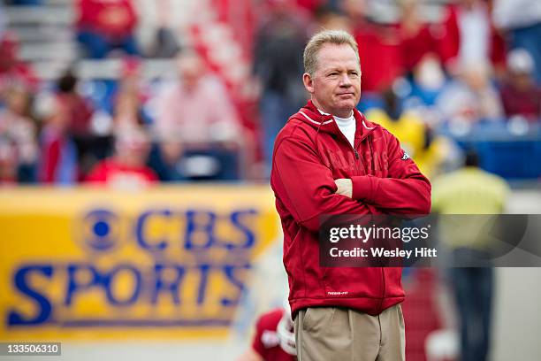 Head Coach Bobby Petrino and the Arkansas Razorbacks watches his team warm up before a game against the Mississippi State Bulldogs at War Memorial...