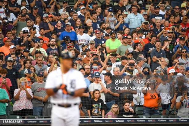 Fans watch while Miguel Cabrera of the Detroit Tigers is at bat against the Los Angeles Angels during the bottom of the first inning at Comerica Park...