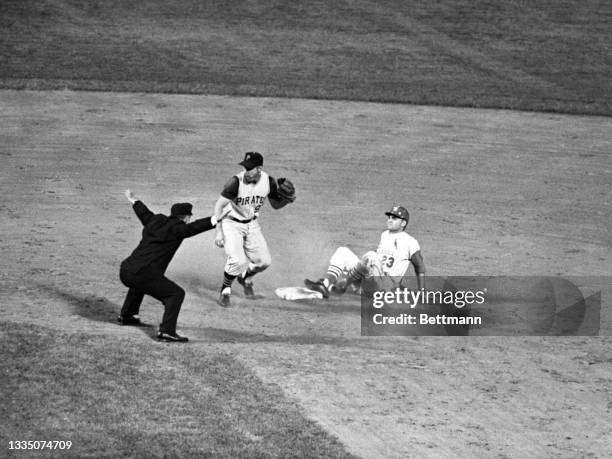 Looking for confirmation, Pirates' Bill Mazeroski can't believe the called safe on Carlie James' stretch double in the 4th inning in Cards-Pirates...