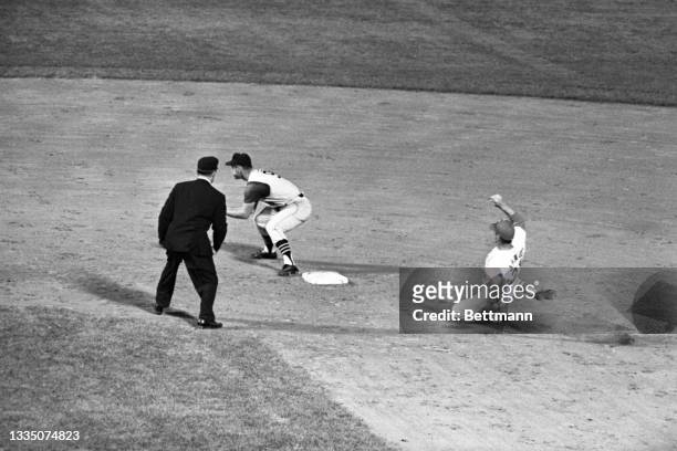Looking for confirmation, Pirates' Bill Mazeroski can't believe the called safe on Carlie James' stretch double in the 4th inning in Cards-Pirates...