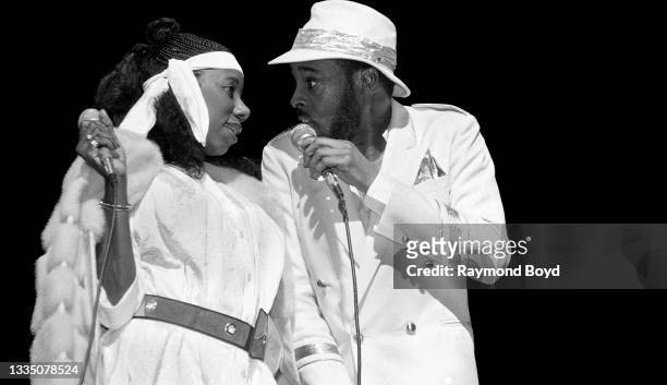 Singers and musician Mary Davis and Abdul Ra'oof of The S.O.S. Band performs at the Auditorium Theatre in Chicago, Illinois in 1985.