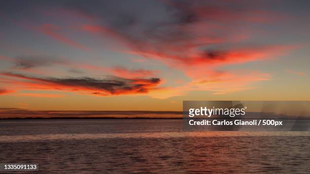 scenic view of sea against dramatic sky during sunset,buenos aires province,argentina - paisajes argentina stock-fotos und bilder