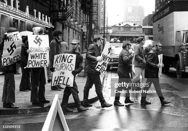 Members of a neo-Nazi group march in Chicago carrying racist signs, 1973.