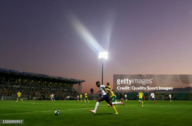 Ryan Sessegnon of Tottenham Hotspur runs with the ball under pressure from Fernando Fonseca of Pacos De Ferreira during the UEFA Conference League...