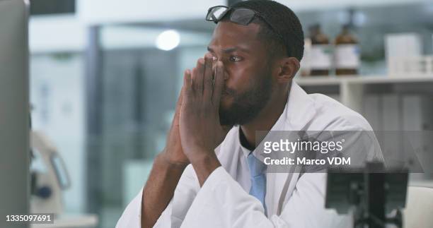 shot of a young scientist working on a computer in a lab - tech frustration stock pictures, royalty-free photos & images