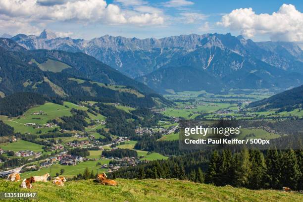 scenic view of landscape and mountains against sky,leogang,austria - keiffer stock pictures, royalty-free photos & images