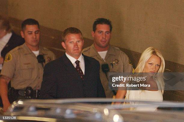 Actress Pamela Anderson exits the Los Angeles County Courthouse after a custody hearing resulting from her divorce to former Motley Crue drummer,...