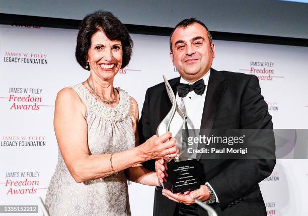 Achievement awardee Ali Soufan onstage with Diane Foley, mother of the late James Foley, at the 2021 James W. Foley Freedom Awards at National Press...