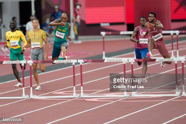 Allison dos Santos of Brazil and Abderrahman Samba of Qatar, in action during the semifinals of the men's 400 metres hurdles at the Olympic Stadium...