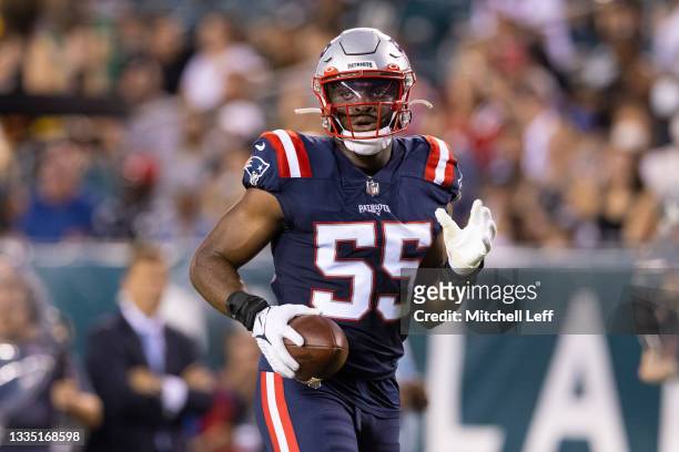 Josh Uche of the New England Patriots looks on against the Philadelphia Eagles in the preseason game at Lincoln Financial Field on August 19, 2021 in...