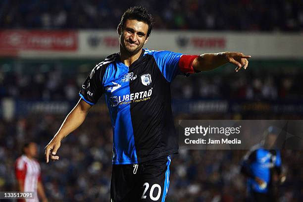 Carlos Bueno of Queretaro celebrates a scored goal against Chivas during a match as part of the Quarter final of the Apertura 2011 at La Corregidora...