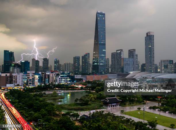 lightning over songdo city - songdo ibd stock pictures, royalty-free photos & images