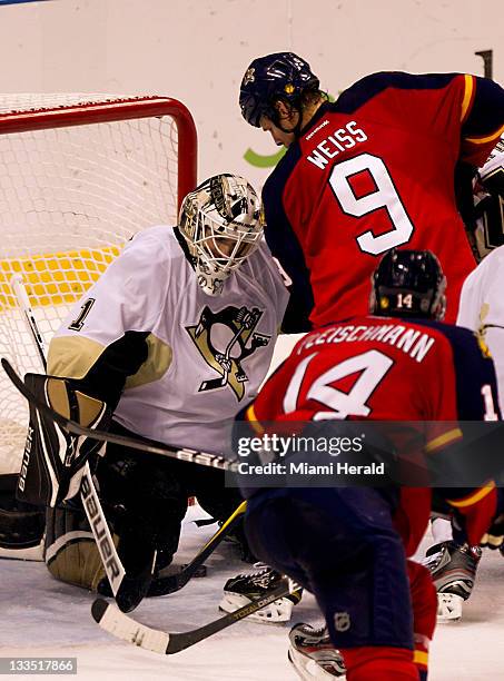 The Florida Panthers' Stephen Weiss scores a goal past Pittsburgh Penguins goalie Brent Johnson in the third period at Bank Atlantic Center in...