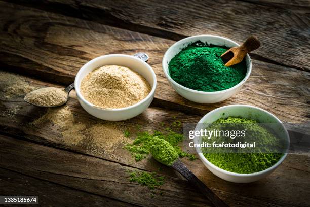 nutritional supplements: spirulina, maca and moringa - maca plant stock pictures, royalty-free photos & images