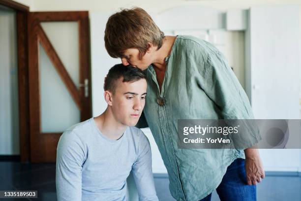 teenage boy in troubles - mother son stock pictures, royalty-free photos & images