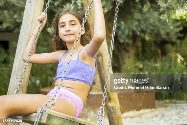 beautiful girl enjoying to swing - swimsuit models girls stock pictures, royalty-free photos & images