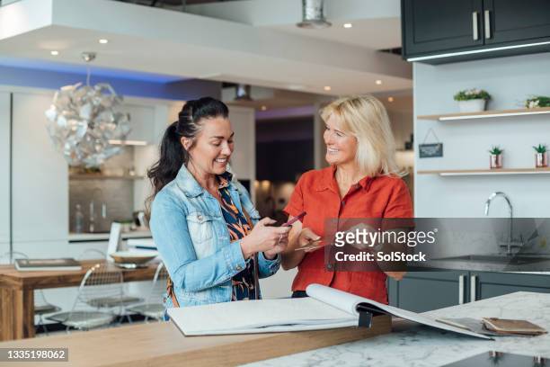 helping a customer - furniture showroom stock pictures, royalty-free photos & images