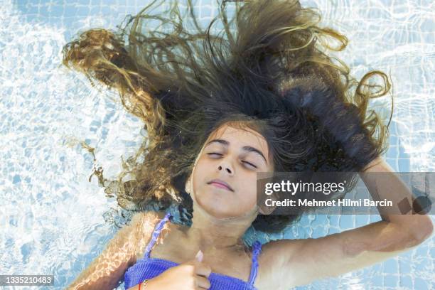 beautiful girl relaxation to swimming pool - hot body girls stock pictures, royalty-free photos & images