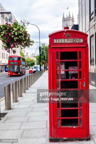 red phone booth and double decker bus in london - millennium wheel stock pictures, royalty-free photos & images