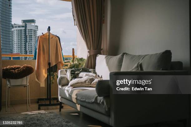 wet cloth clothesline clothespin hanging at balcony in the morning - carpet mess stock pictures, royalty-free photos & images