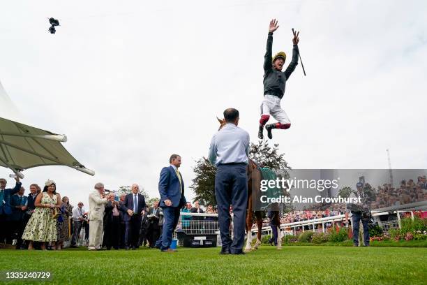 Frankie Dettori leaps from Stradivarius after winning The Weatherbys Hamilton Lonsdale Cup Stakes at York Racecourse on August 20, 2021 in York,...