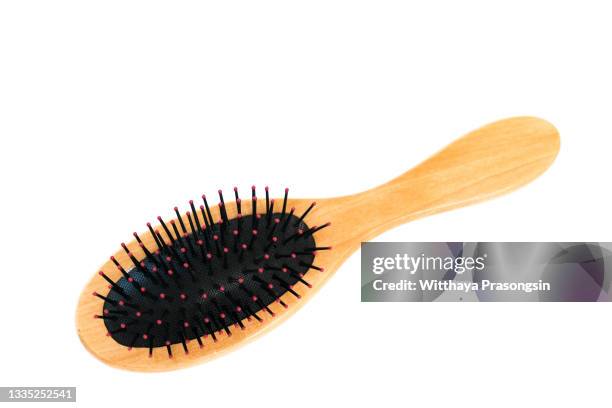 wooden hair brush isolated on white background. - cepillar el cabello fotografías e imágenes de stock