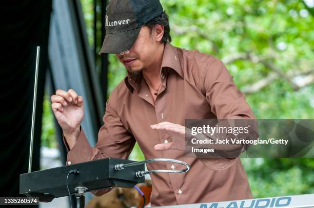 French Pop musician and composer Marc Chouarain plays theremin at the 'Fete de la Musicque' concert at Central Park SummerStage, New York, New York,...