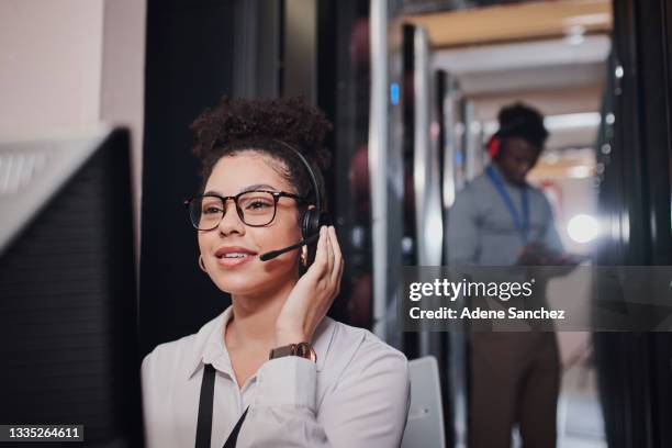 shot of a technical support agent using a computer while working in a data center - data centre cloud stock pictures, royalty-free photos & images