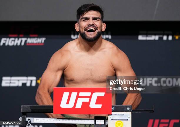 Kelvin Gastelum poses on the scale during the UFC Fight Night weigh-in at UFC APEX on August 20, 2021 in Las Vegas, Nevada.