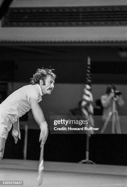 View of Australian tennis player John Newcombe in action during a match on the first day of the 62nd Davis Cup final, Cleveland, Ohio, November 30,...