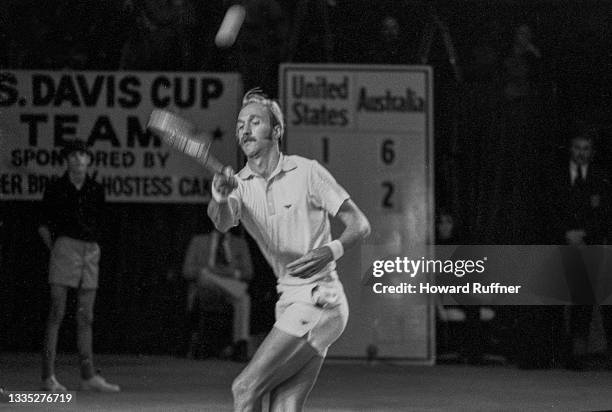 View of Australian tennis player John Newcombe returns a volley during a match on the first day of the 62nd Davis Cup final, Cleveland, Ohio,...