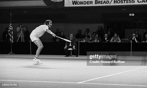 View of Australian tennis player John Newcombe in action during a match on the first day of the 62nd Davis Cup final, Cleveland, Ohio, November 30,...