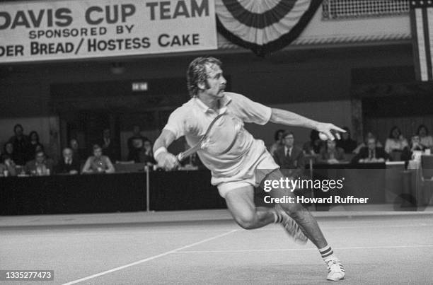 View of Australian tennis player John Newcombe in action during a match on the first day of the 62nd Davis Cup final, Cleveland, Ohio, November 30,...