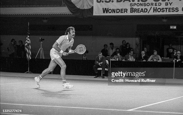 View of Australian tennis player John Newcombe in action during a match on the first day of the 62nd Davis Cup final, Cleveland, Ohio, November 30,...