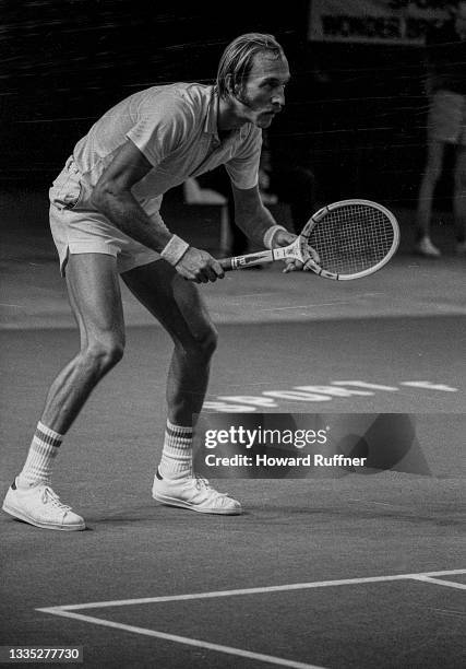 View of Australian tennis player John Newcombe in action during a match on the first day of the 62nd Davis Cup final, Cleveland, Ohio, November 30,...