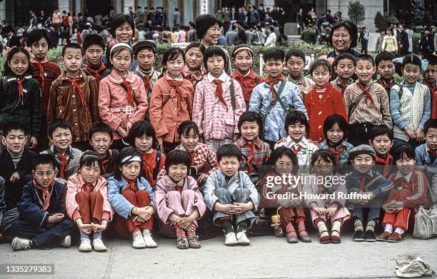 Large group of school children on a field trip pose outside the museum complex at the Mausoleum of the First Qin Emperor, Xi'an, Shaanxi, China,...