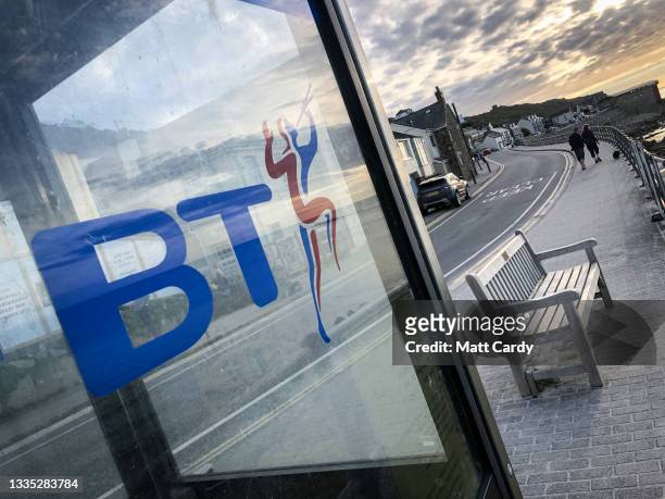 The British Telecom logo is seen in a landline telephone box still in use at Sennen Cove on August 13, 2021 near Penzance in Cornwall, England. The...