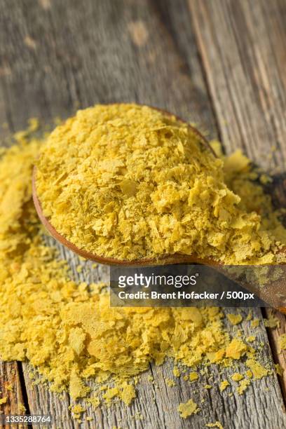 high angle view of turmeric on wooden table - yeast stock pictures, royalty-free photos & images