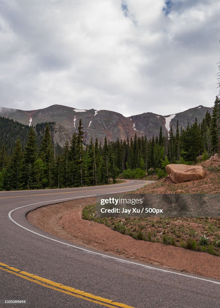 Empty road along landscape against sky,Pikes Peak,Colorado,United States,USA