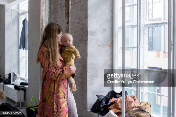 Famous danish model Caroline Brasch Nielsen at the Stine Goya backstage with her baby before Stine Goya show during the Copenhagen Fashion Week...